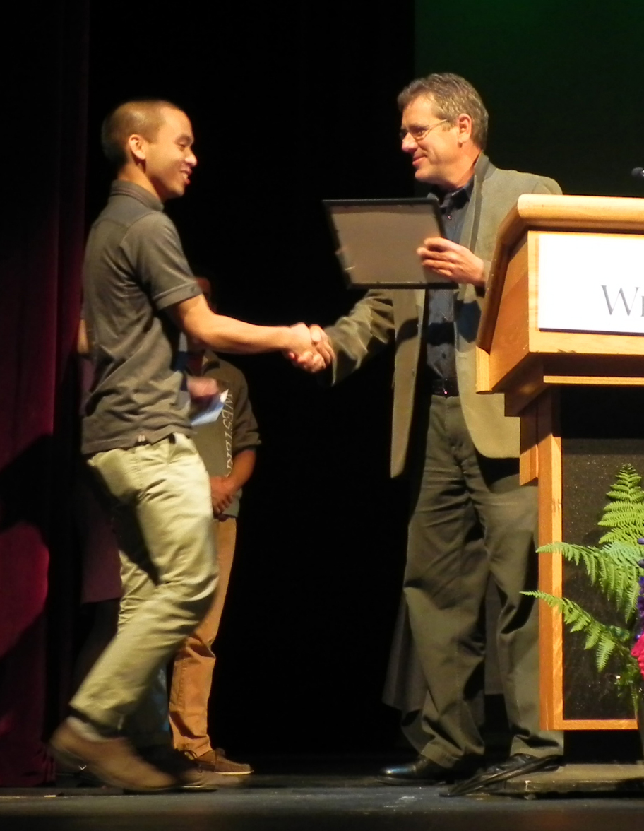A student receiving an award