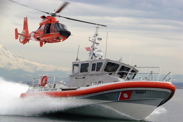 Coast Guard rescue helicopter and boat