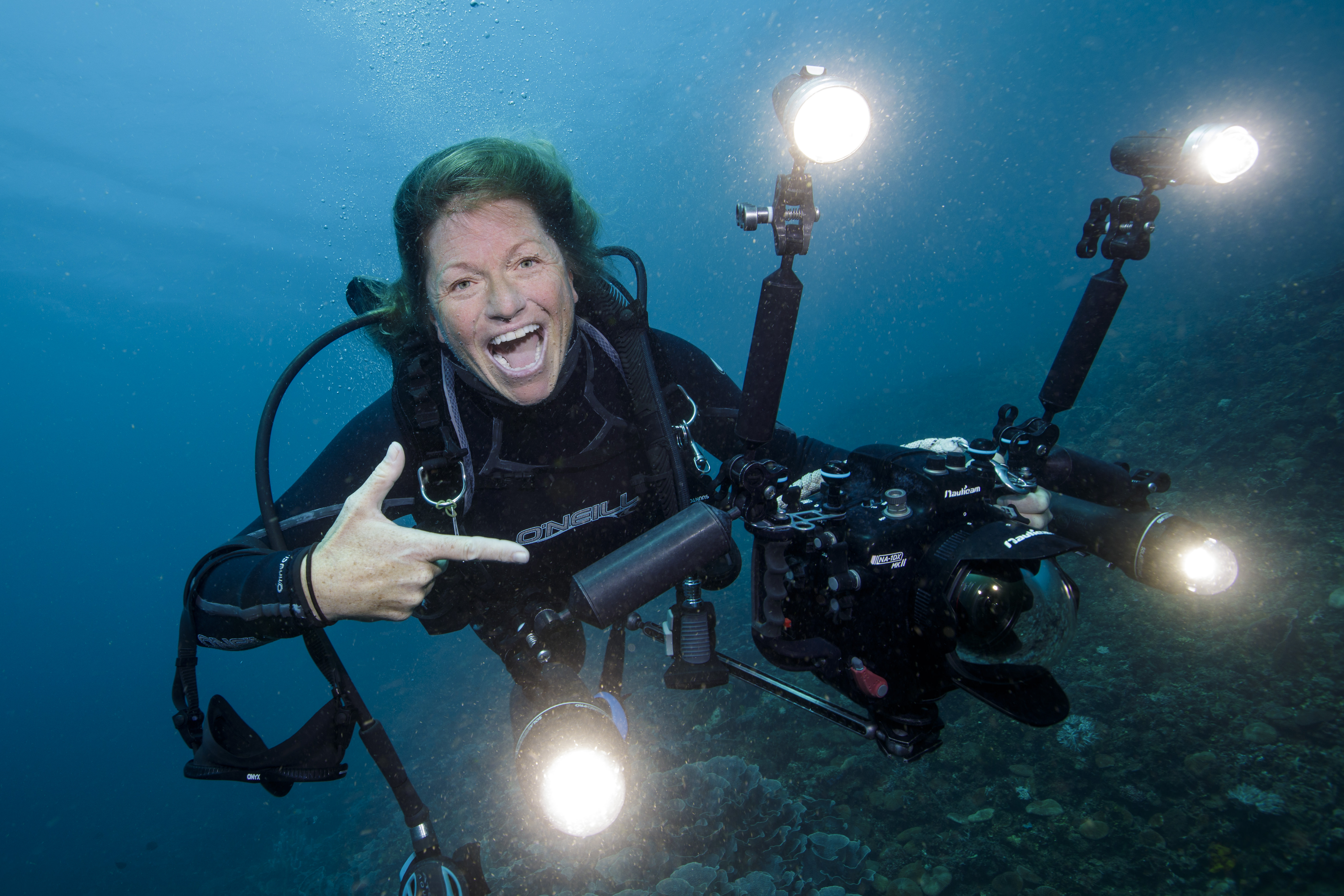Annie Crawley diving with camera gear