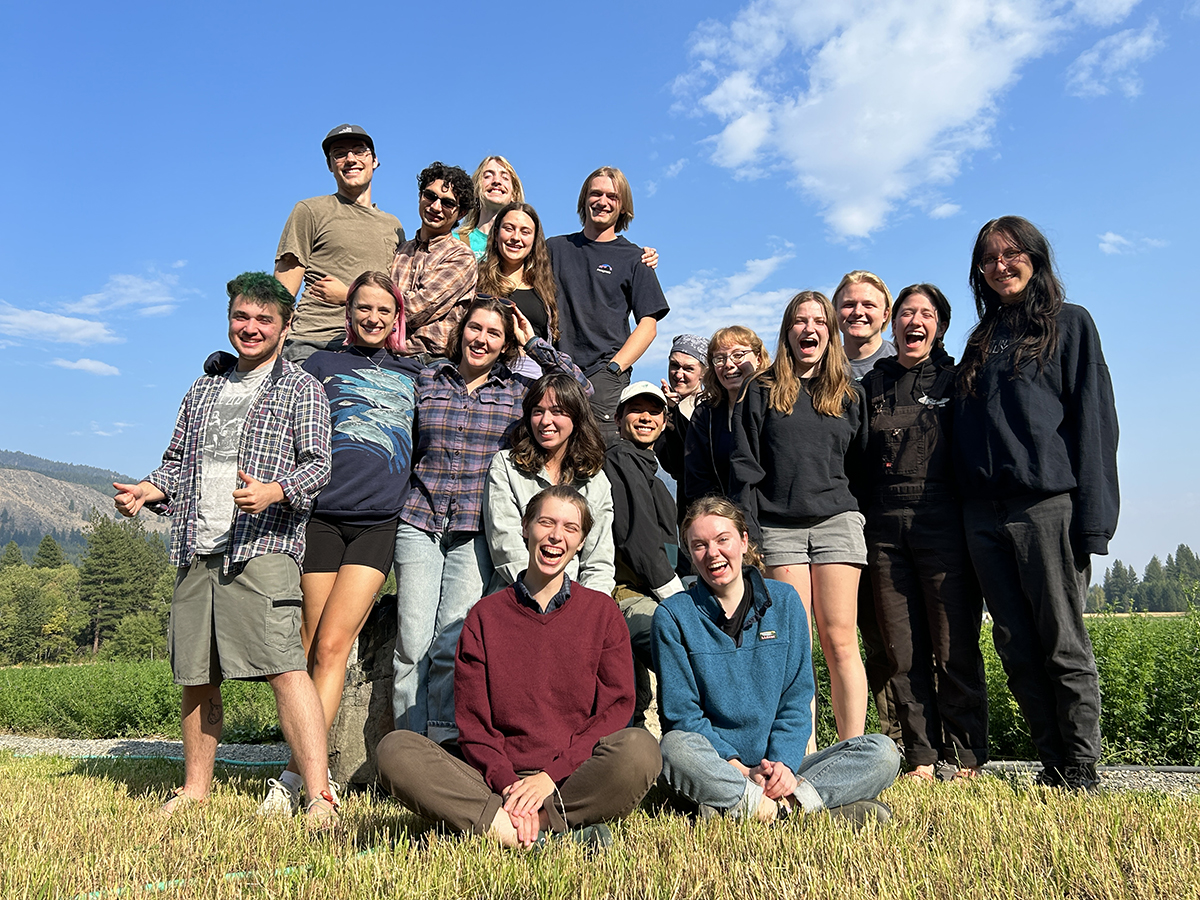 The 2023 cohort of Sustainability Pathways fellows poses for a photo under bright blue skies in the Methow Valley.