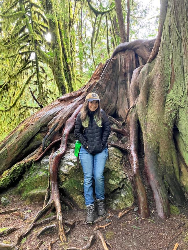 Ariel Shiley stands in front of a huge tree