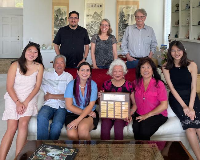 Ashlyn Lee sits next to Ming-Ho Yu's wife and family, with ESCI/Environmental Toxicology faculty in the back row.