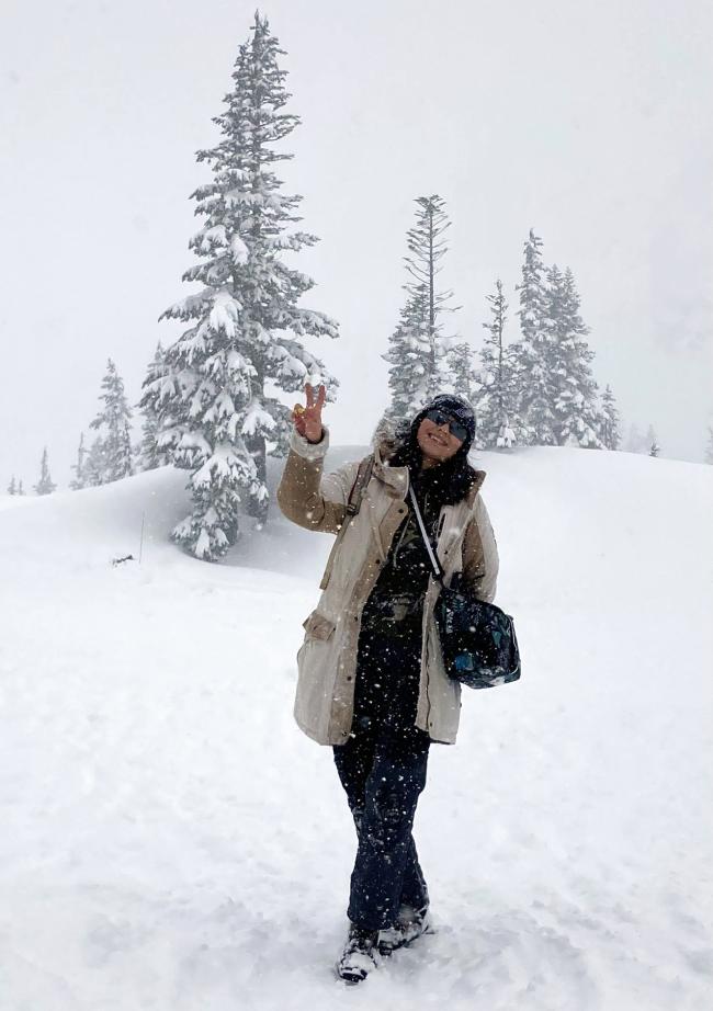Guadalupe Castillo stands in the snow on Mt. Baker at Snow School