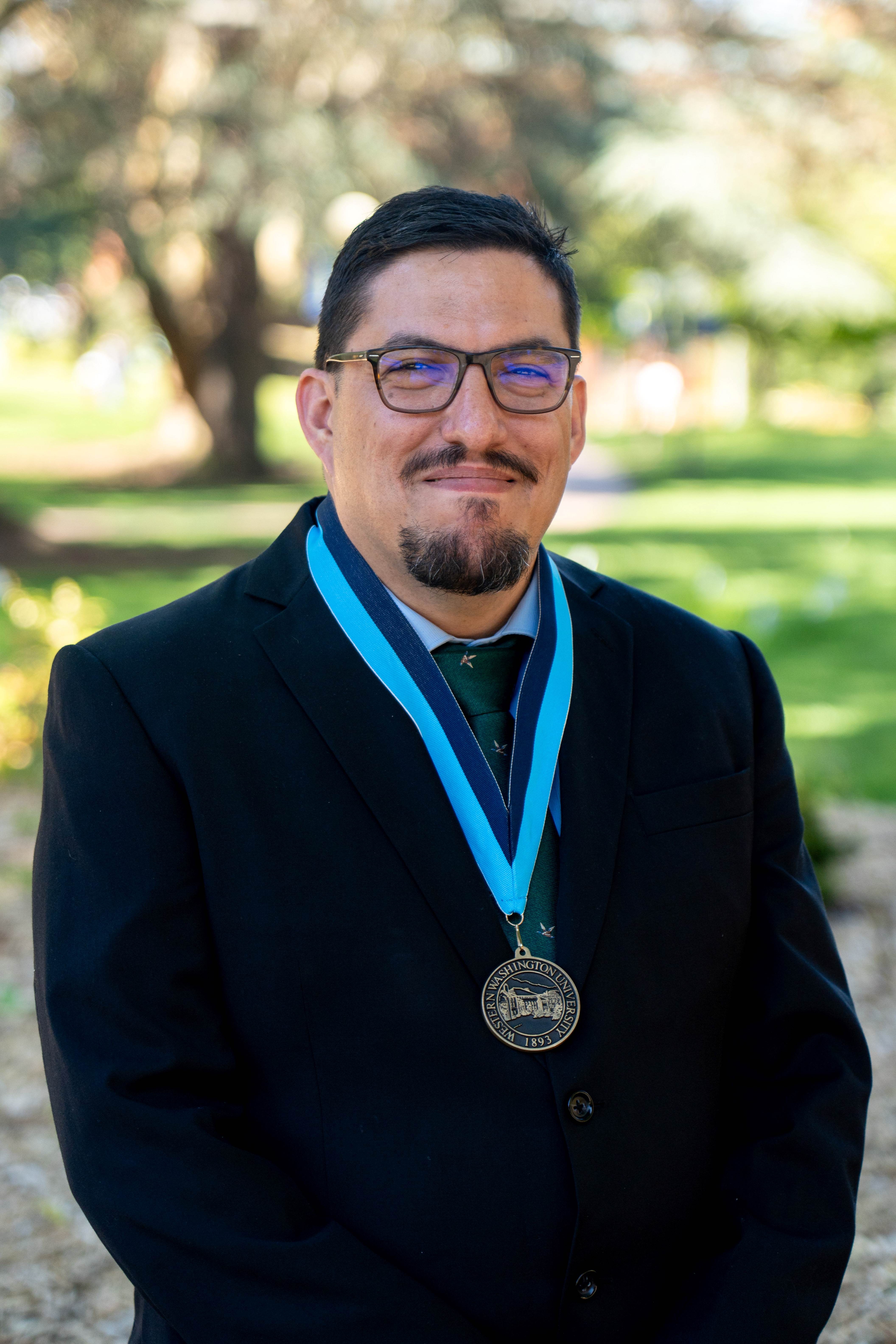 Manuel Montaño wears the Excellence in Teaching Award medal